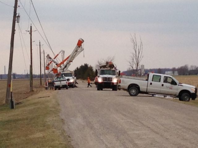 Hydro One crews fixing downed power lines on Baseline Road outside Port Lambton.