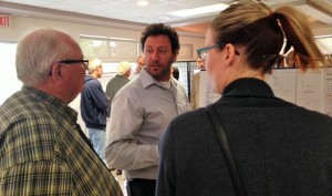 Adam Rosso talking with residents at the open house meeting.
